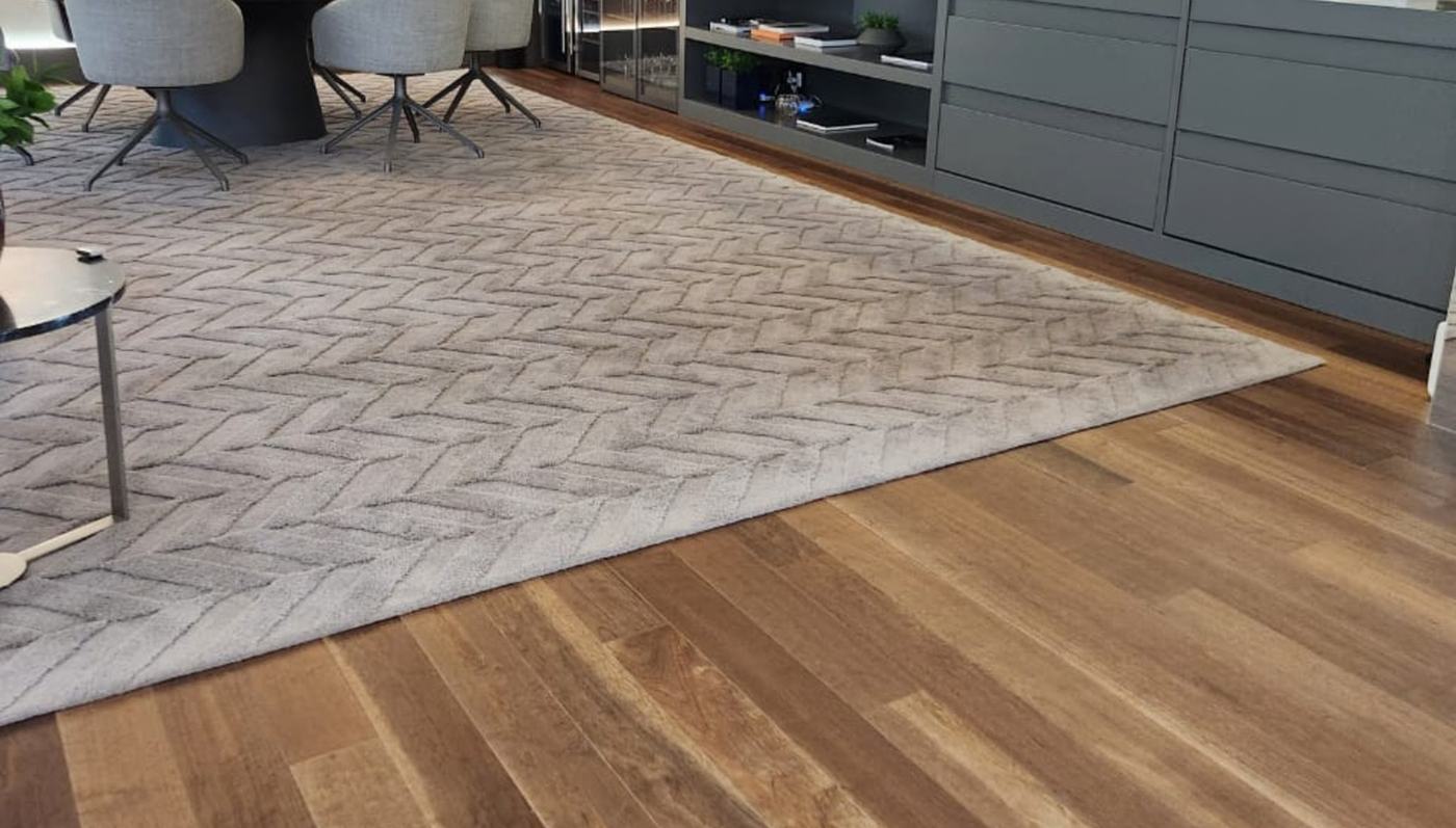 Quaruba Natural flooring in an open-plan interior with a wool rug